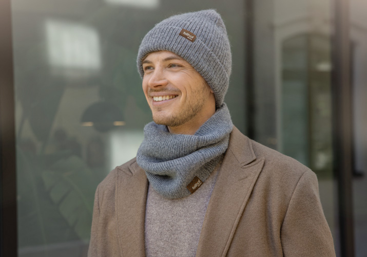 man wearing grey alpaca hat and scarf